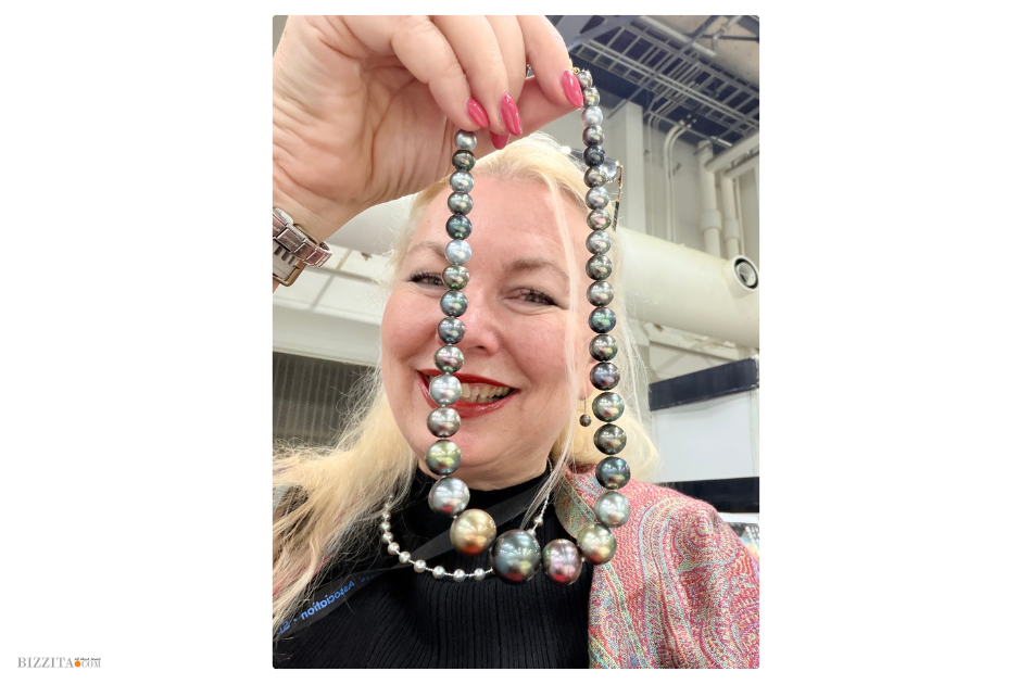 Esther holding up a string of tahitian pearls that she bought during the 7th Japan Pearl fair in Kobe, Japan